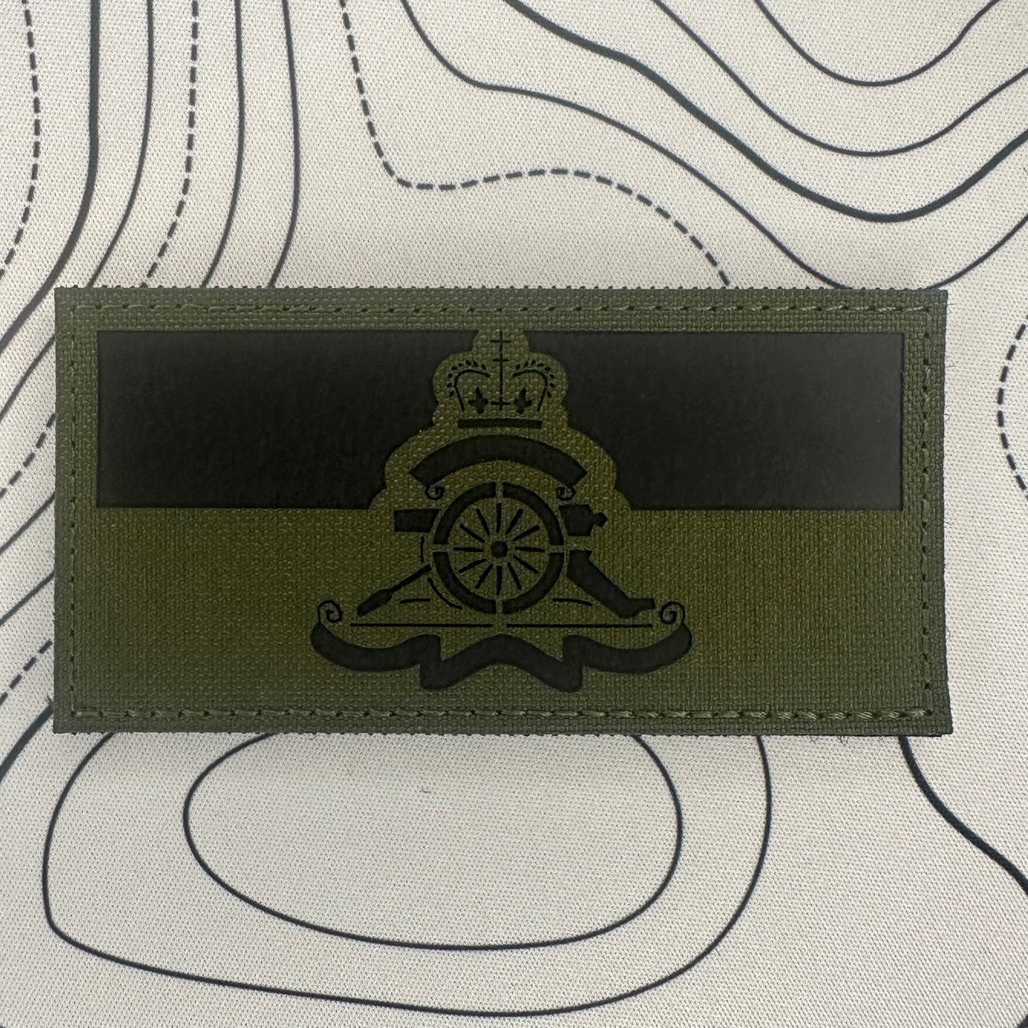 Royal artillery cap badge over TRF (subdued)